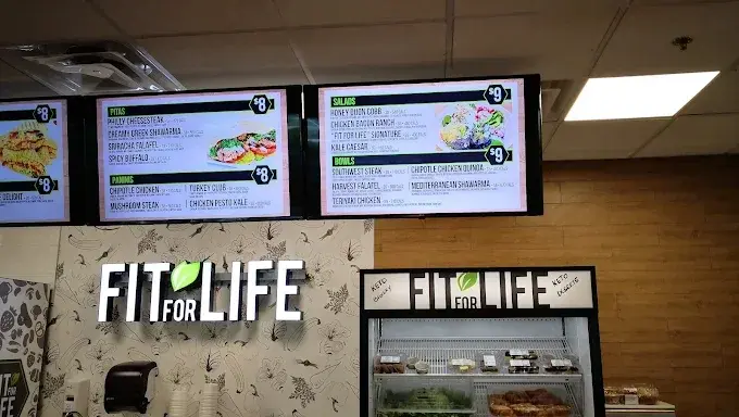 The Fit For Life Cafe menu boards and illuminated sign inside the Medical Centre at The Boardwalk, Waterloo